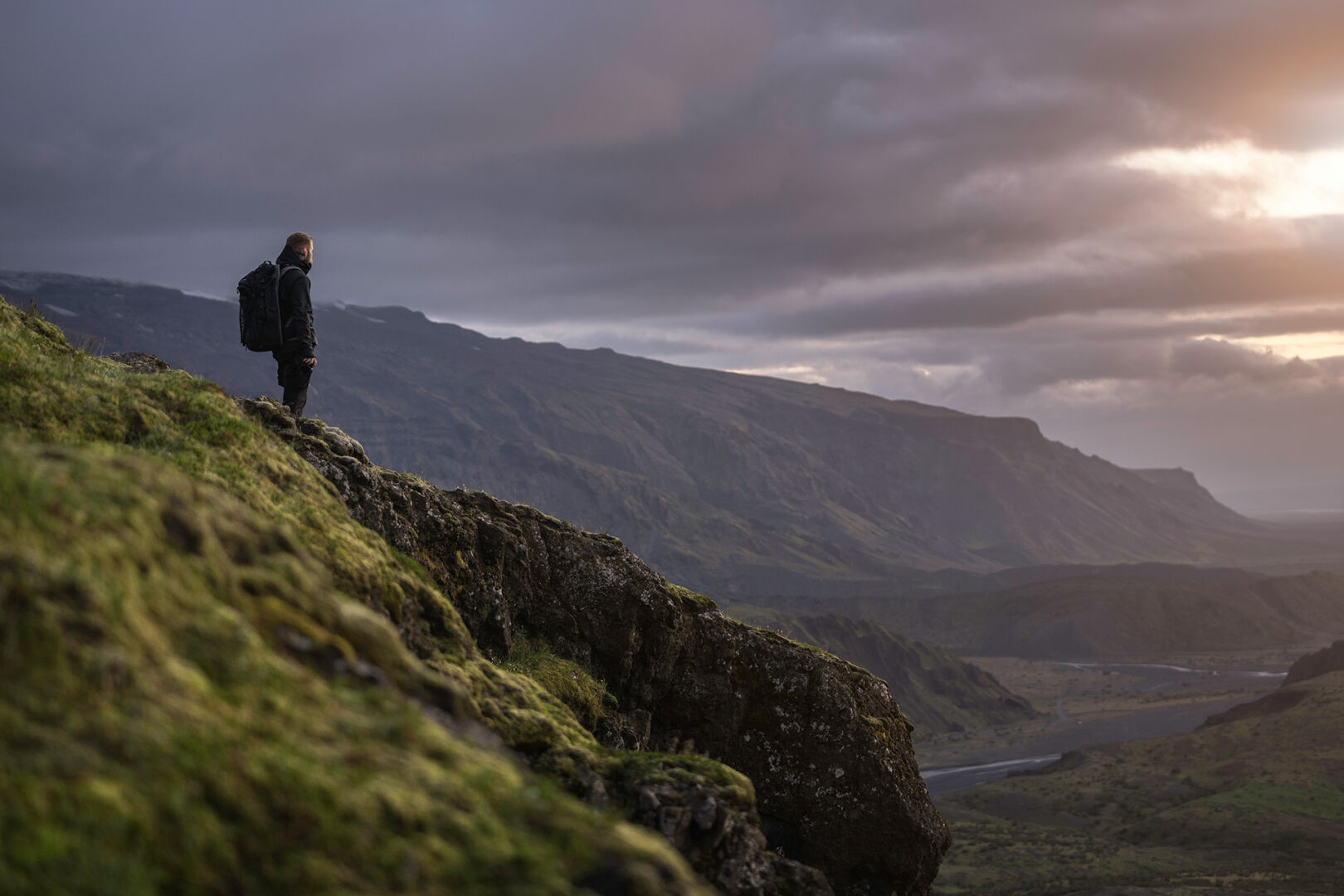 man gleaming over a mountain scenery